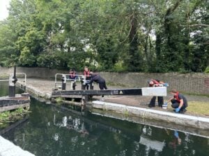 Tug Volunteers Painting a Canal
